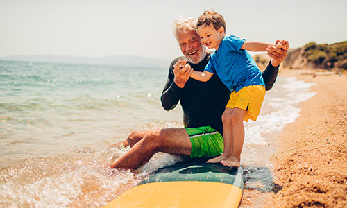 Man and a child at the beach